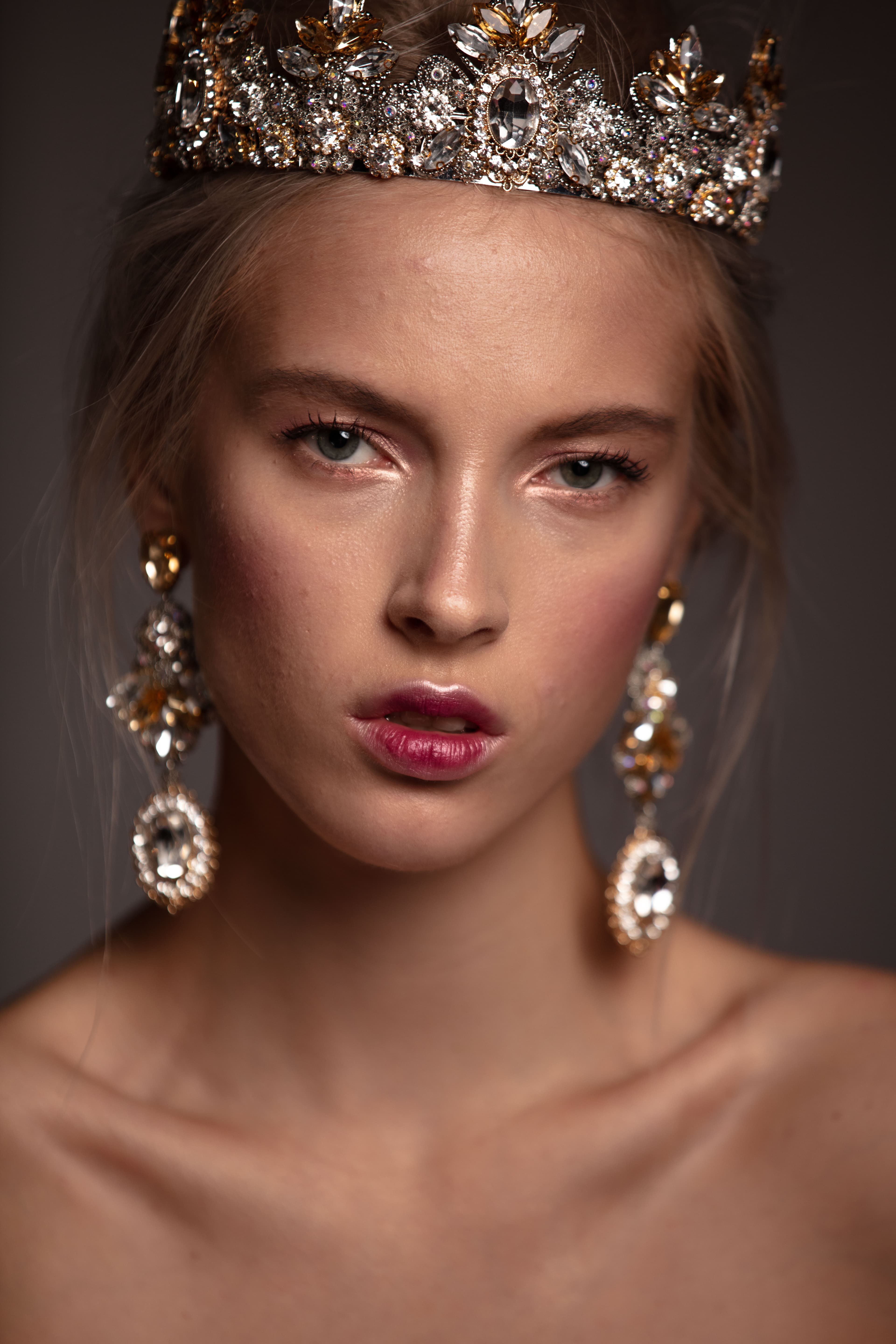 Before — crown editorial portrait unretouched, showing pores, subtle redness, and natural skin texture
