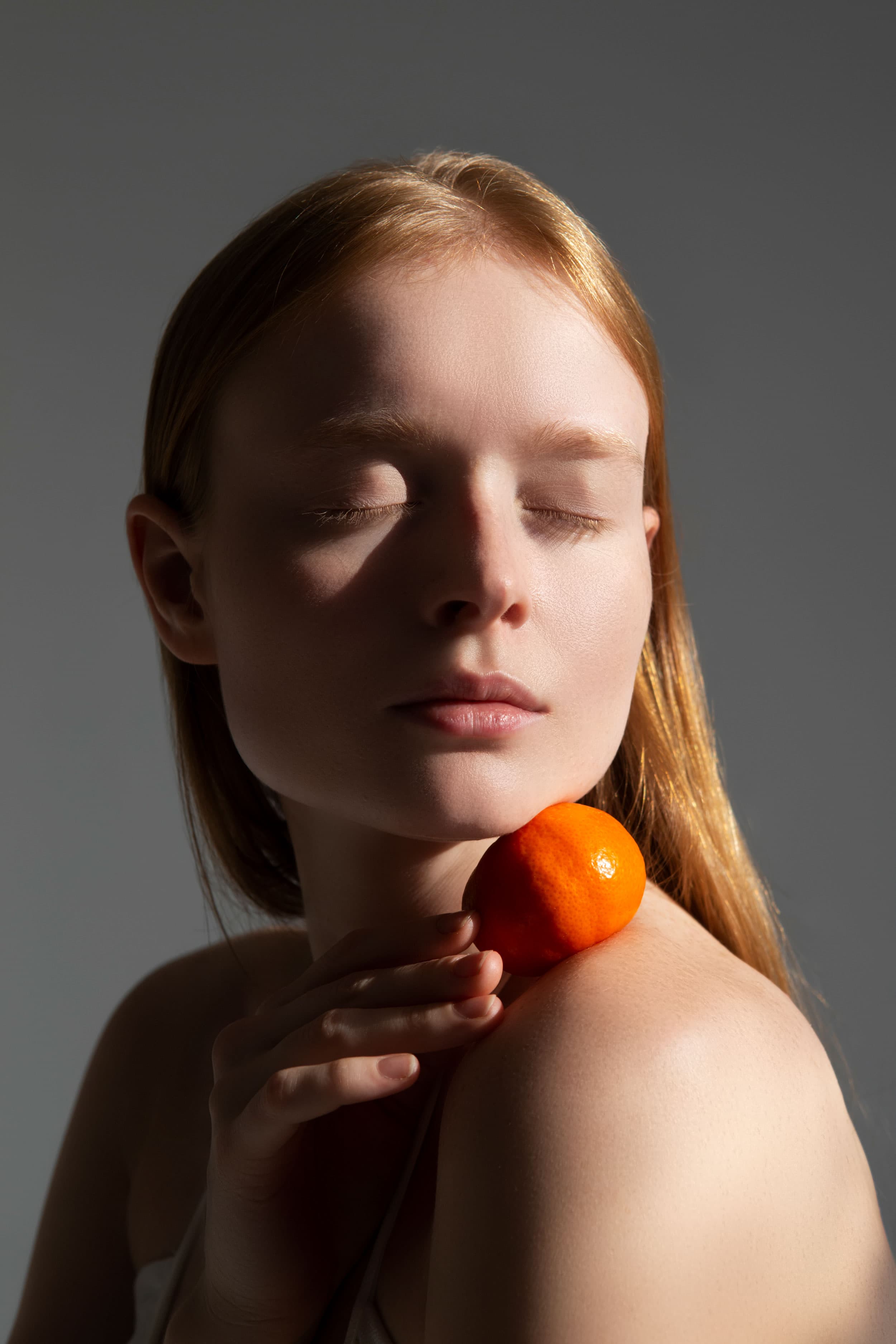 After — redhead model with freckles retouched with Olune Skin — freckles preserved, skin evened without losing the natural look